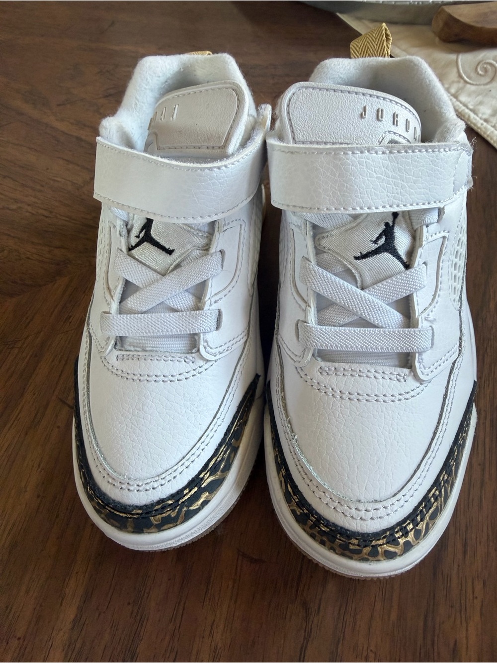 Nike Air Jordan White Leather Low Basketball Shoes with Gold Accent